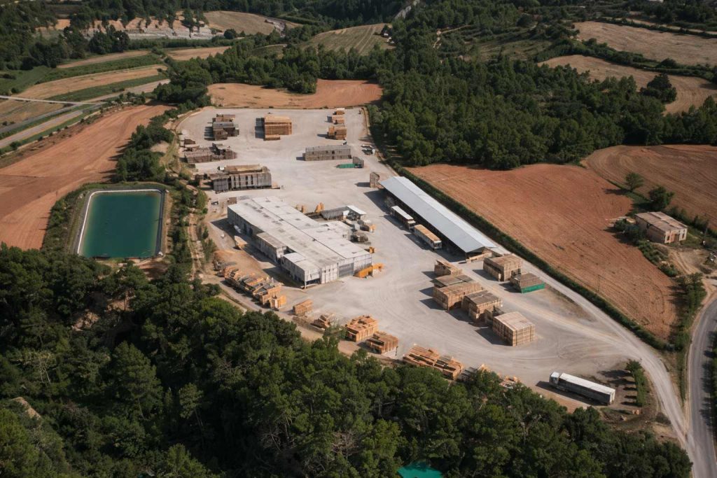 Aerial view of an industrial facility affected by a sparrow infestation in a rural environment